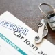 Image of car loan agreement and car key Economic abuse using car finance