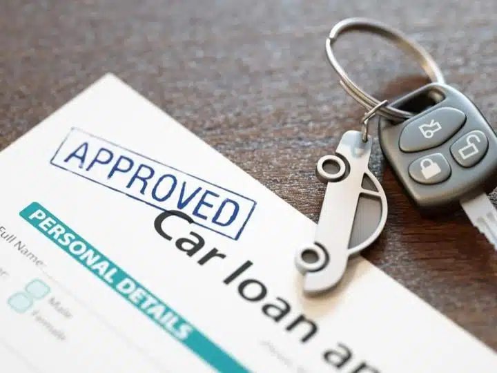Image of car loan agreement and car key Economic abuse using car finance
