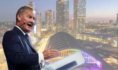 Rupert Lowe of Restore Britain and a scene of Manchester city centrescape with vibrant infrastructure in the background