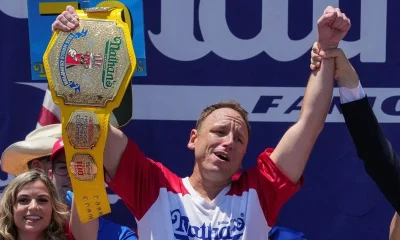 Eating champion Joey Chestnut defends title but blames heat for lower hot-dog tally