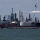 Oil slips after OPEC+ agrees to raise output targets