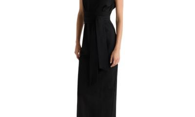 A woman wearing a black dress and low black heels