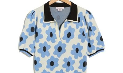 A black, white, and blue short-sleeved polo sweater