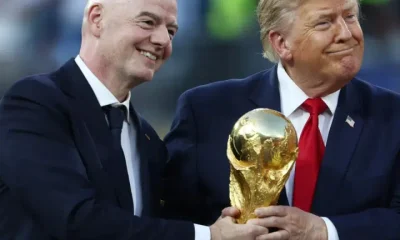 Infantino and Trump holding the FIFA World Cup