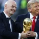 Infantino and Trump holding the FIFA World Cup