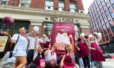 Campaigners outside Pret with a giant birthday card