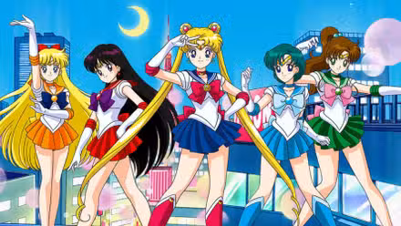 Cast of Sailor Moon posing on a building at night