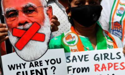 An activist holds a cut-out of the prime minister of India, Narendra Modi, at a protest over another gang-rape and murder of a young woman in Uttar Pradesh state in 2020