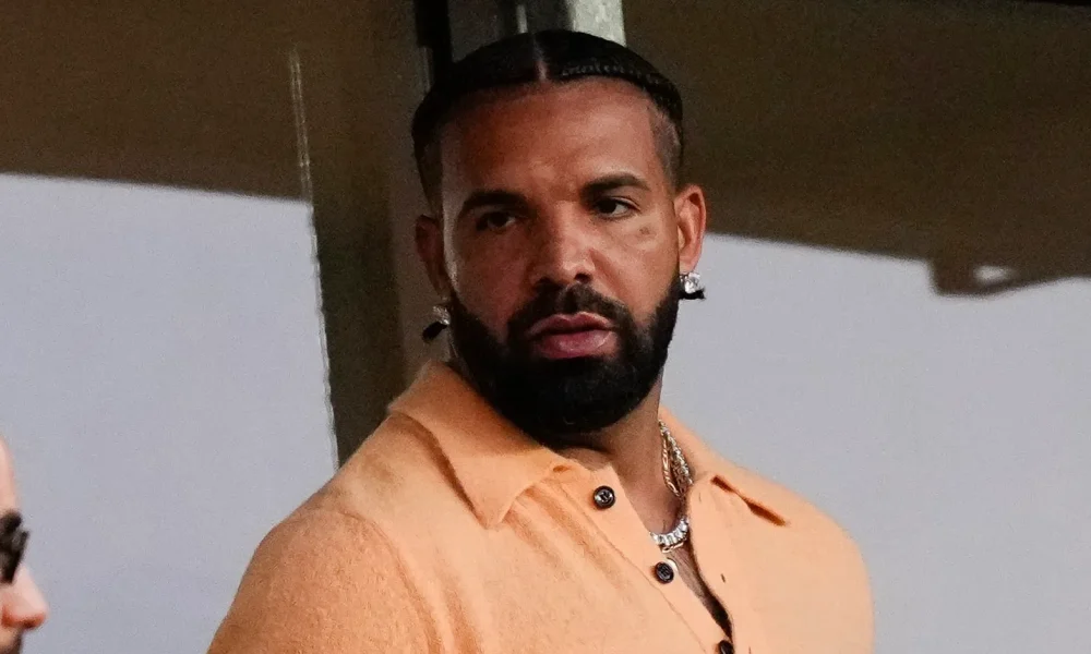 Who's That? Social Media Users Are Chattin' After Livestream Showed Drake With His Arm Around Mystery Woman (WATCH)