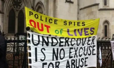 Spycops campaign banners outside Royal Courts of Justice during the Undercover Policing Inquiry