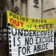 Spycops campaign banners outside Royal Courts of Justice during the Undercover Policing Inquiry