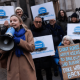 Thames Water protestors outside with megaphones and one placard that reads: 'Don't force water users to bail out bad business. Take water back'.