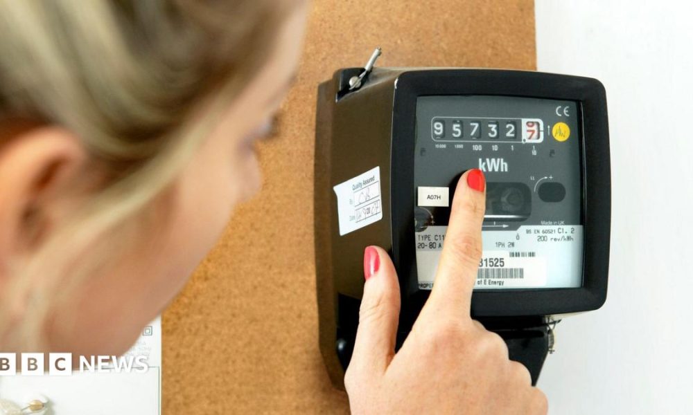 A woman in a pink bikini lies on a deck chair covered in pink blankets, reads a magazine. there are pink towels, a tote bag and a radio next to her.