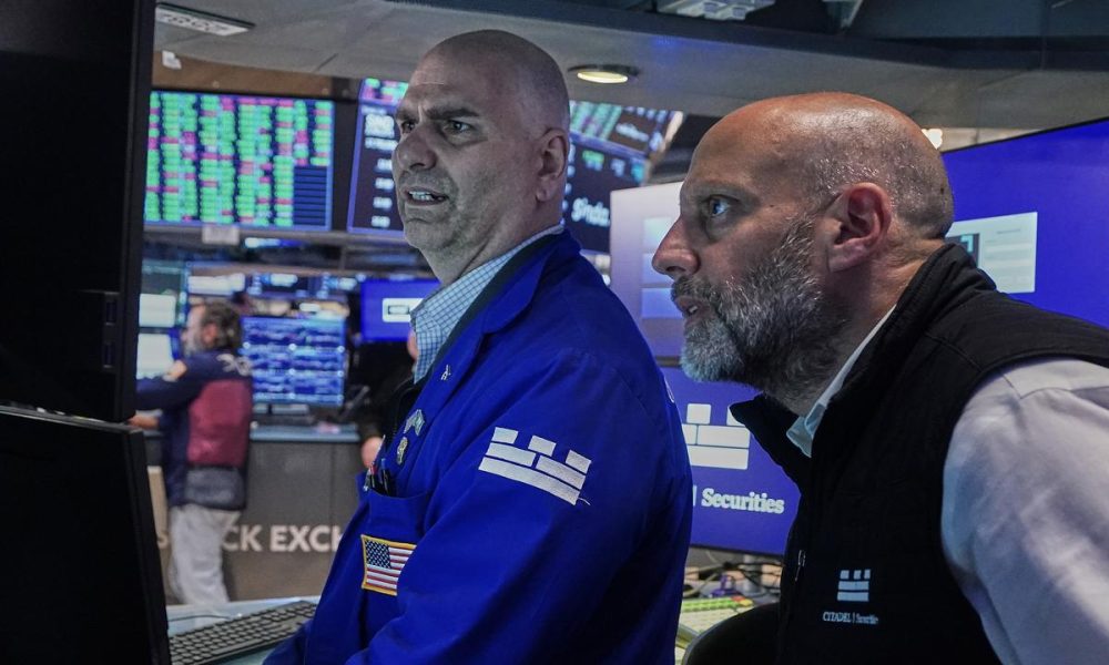 Dow hits record closing high after soft US jobs data