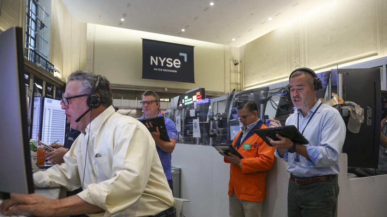 Wall St falls as chip weakness offsets solid earnings