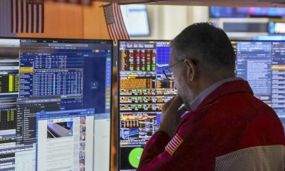 Wall St ends mixed as investors focus on tech earnings