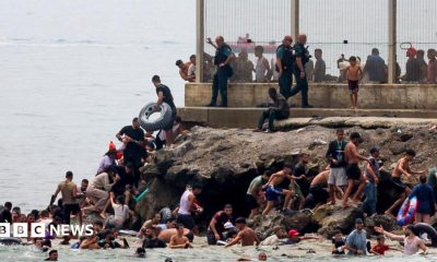 panish military stands guard at the border between the Spanish enclave of Ceuta and Morocco