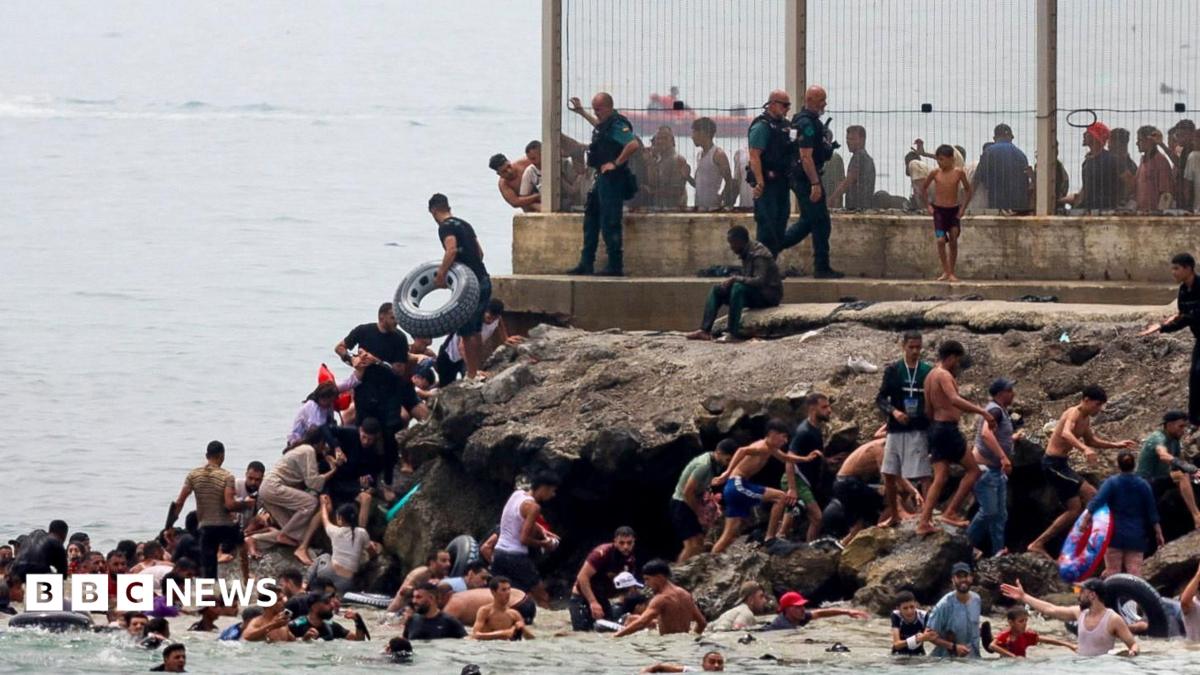 panish military stands guard at the border between the Spanish enclave of Ceuta and Morocco