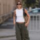 BERLIN, GERMANY - JUNE 22: Sophia Geiss seen wearing a white Almina Concept sleeveless top, olive green The Frankie Shop wide-leg long pants, Mango black sunglasses, a Gucci shoulder brown bag and white Havaianas flip-flops on June 22, 2026 in Berlin, Germany. (Photo by Jeremy Moeller/Getty Images)