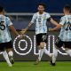 Argentina's Lionel Messi (C) celebrates with teammates Nicolas Gonzalez (L) and Giovani Lo Celso