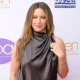 Ashley Tisdale posing on the red carpet.