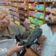 Sue Mitchell (L) holds microphone to Twana Jamal (R)