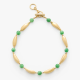 golden necklace with green beads