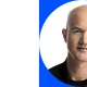 Coinbase now writes 95–100% of its code with AI assistance, up from 40% five months ago. Vibe coding and Armstrong's leaner operation.