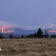 Stretch of mountains in the Cairngorms with wildfires burning across a large area