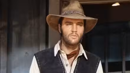 Elvis Presley as Jess Wade looking at person offscreen in Charro!