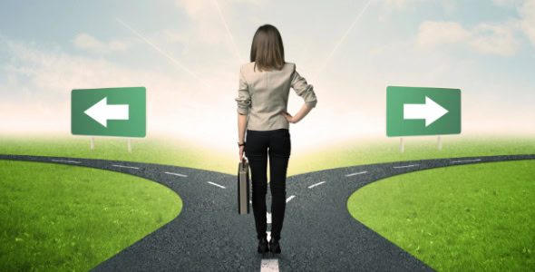 businesswoman stands at a crossroads and must make a decision