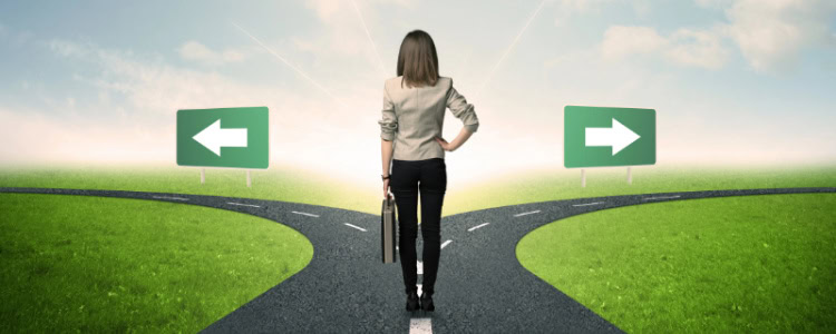 businesswoman stands at a crossroads and must make a decision