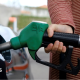 A person filling up their car with petrol