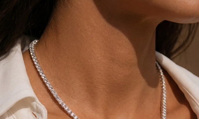 woman wears very blingy necklace