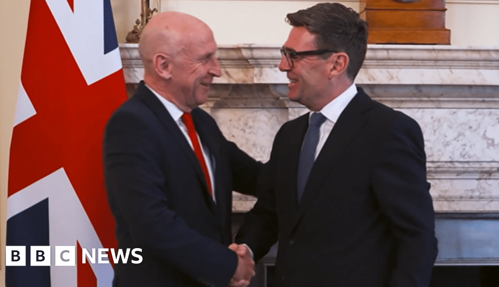 John Healey and Andy Burnham shake hands