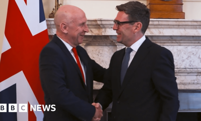 John Healey and Andy Burnham shake hands