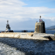A shot of a Vanguard submarine half submerged in the water.