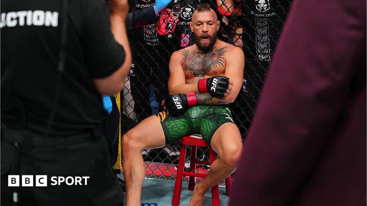 Conor McGregor sits on a stool