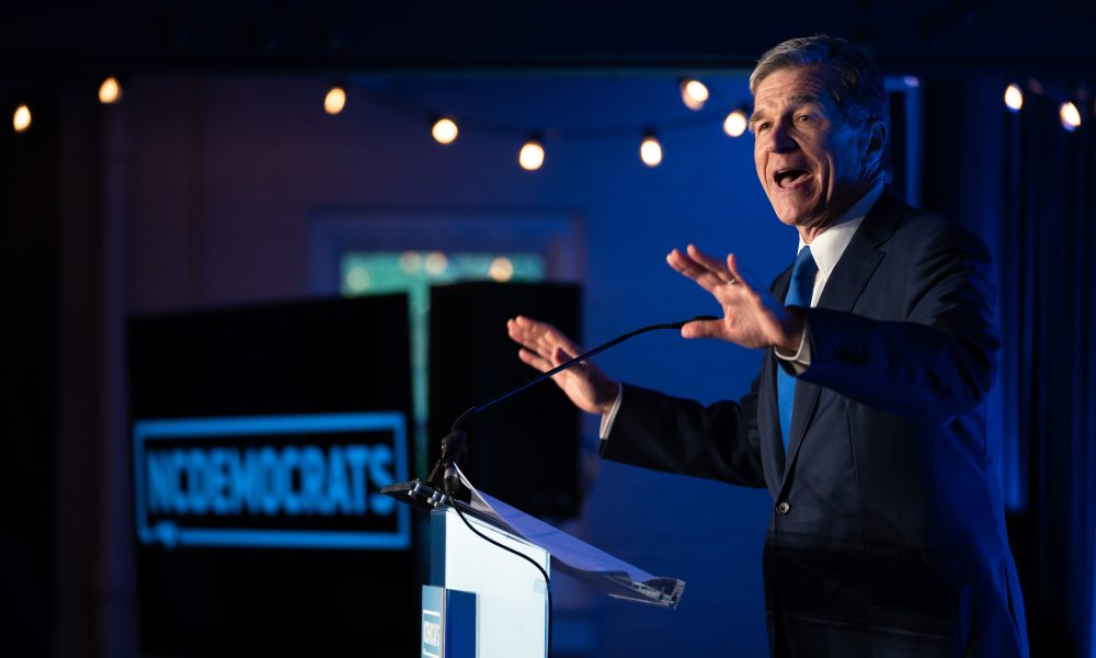 Then-North Carolina Gov. Roy Cooper speaks to the crowd during an event in May 17, 2022, in Raleigh.