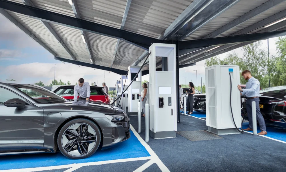 UK, York, People charging their electric cars at charging station