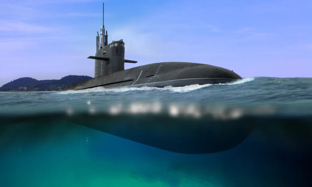 Naval submarine floating and half submerged in shallow water