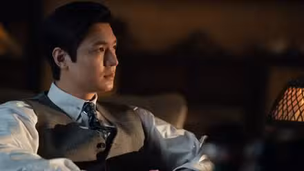 Lee Min-ho, looking at something, as Koh Hansu in Pachinko Season 2.
