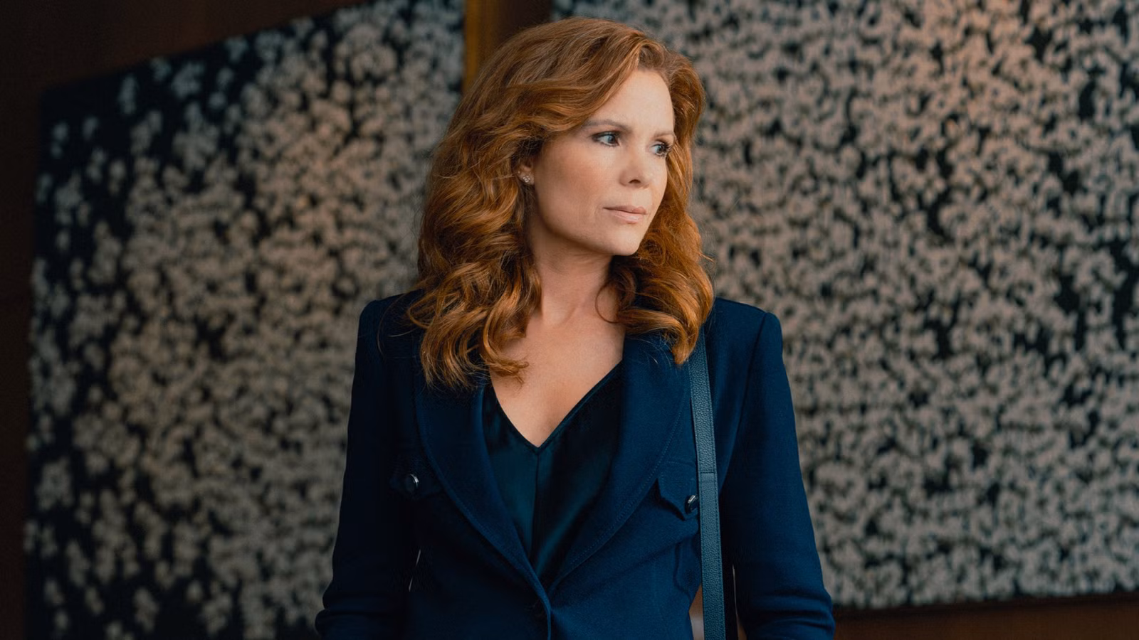 Robyn Lively stands in an office building in Lioness