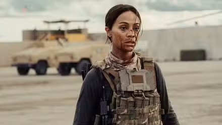 Joe McNamara (Zoe Saldaña) covered in blood after a transport goes wrong in 'Lioness' Season 2.