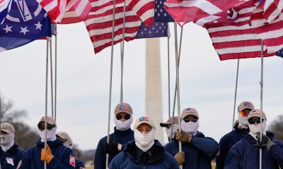 Demonstrators in white supremacist attire protest on Capitol Hill