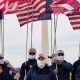 Demonstrators in white supremacist attire protest on Capitol Hill