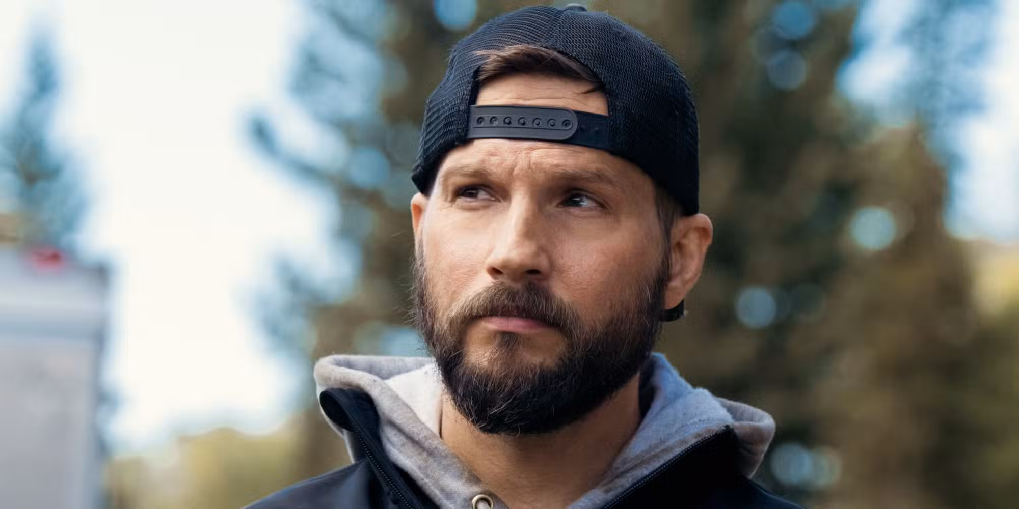 Logan Marshall-Green as Cal standing outside and looking concerned in Marshals