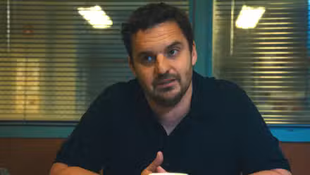 Jake Johnson staring ahead in Maximum Pleasure Guaranteed