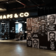 Men's faces artwork decorating a salon wall