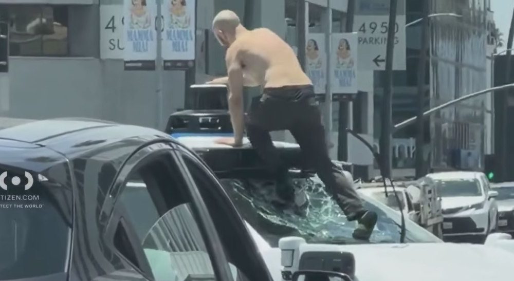 Shirtless Man Arrested After Vandalizing Waymo, Halting Traffic in Busy